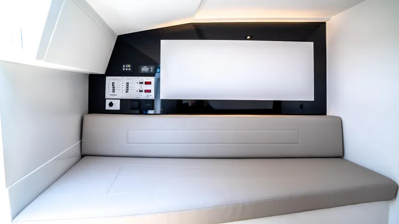  Yacht Photos Pics Interior of 2023 VanDutch 32 yacht with sleek seating and control panel.