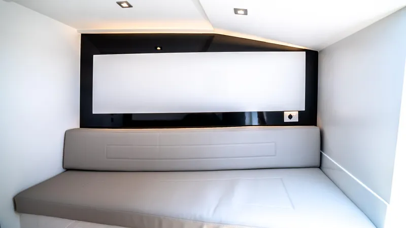  Yacht Photos Pics Interior of 2023 VanDutch 32 yacht, featuring sleek modern design with a comfortable gray seating area.