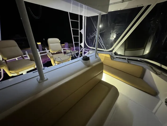  Yacht Photos Pics 1990 Hatteras 45 Convertible yacht interior with seating and night lighting.