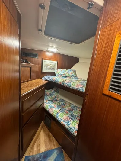  Yacht Photos Pics 1990 Hatteras 45 Convertible cabin with wooden interior and bunk beds.
