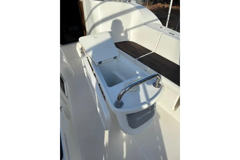  Yacht Photos Pics 2009 Jeanneau Sun Odyssey 39i cockpit with open storage compartment and seating area.