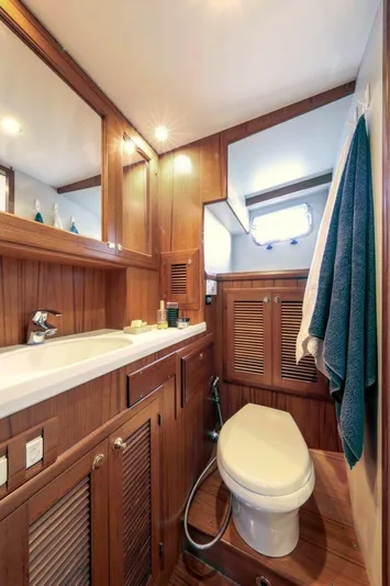 My Lindavia Yacht Photos Pics Luxurious wooden bathroom interior of 2012 Kadey-Krogen 44 yacht with modern amenities.