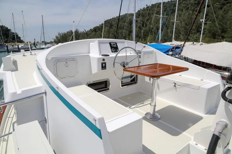 My Lindavia Yacht Photos Pics Kadey-Krogen 44 yacht cockpit, 2012 model, featuring steering wheel and wooden table.