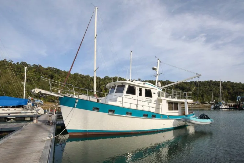 My Lindavia Yacht Photos Pics Kadey-Krogen 44 yacht, 2012 model, docked in a serene marina setting.