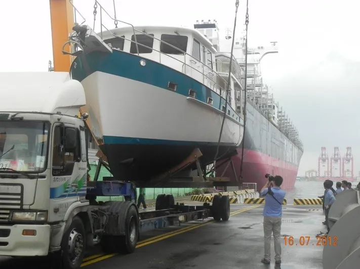 My Lindavia Yacht Photos Pics 2012 Kadey-Krogen 44 yacht being loaded onto a truck at a busy port.