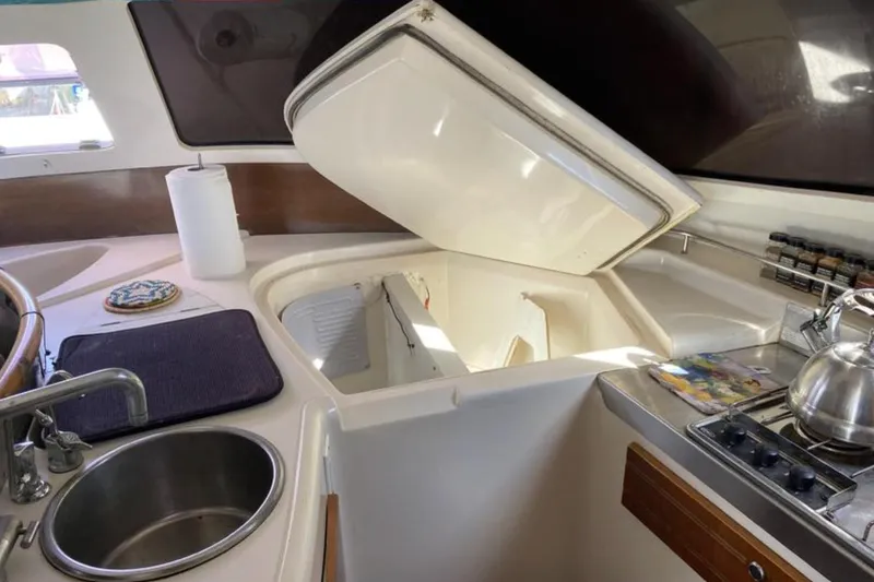 Let It Be Yacht Photos Pics 2003 Fountaine Pajot Bahia yacht kitchen with sink, stove, and storage.