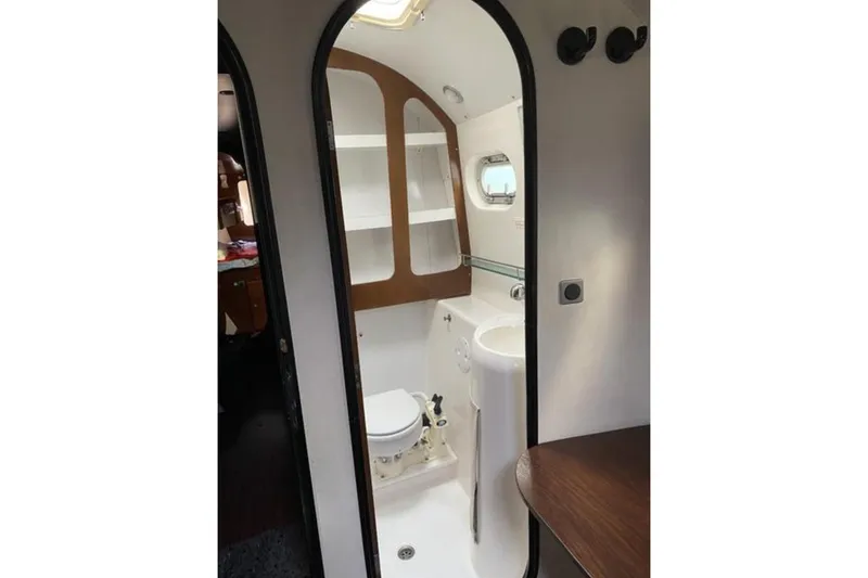 Let It Be Yacht Photos Pics 2003 Fountaine Pajot Bahia yacht bathroom with modern fixtures and wooden accents.