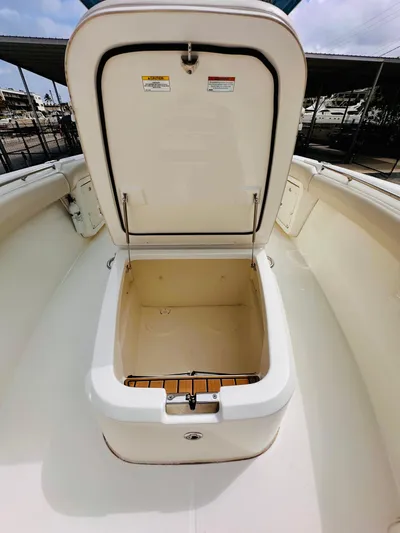 Priced To Sell! Yacht Photos Pics 2020 Boston Whaler 280 Outrage storage compartment open, showcasing spacious interior.