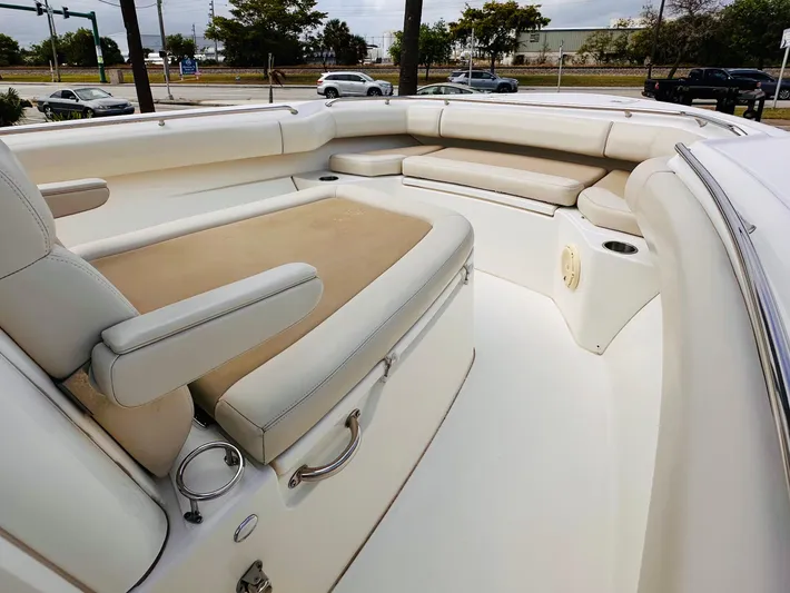 Priced To Sell! Yacht Photos Pics 2020 Boston Whaler 280 Outrage boat interior with cushioned seating and sleek design.