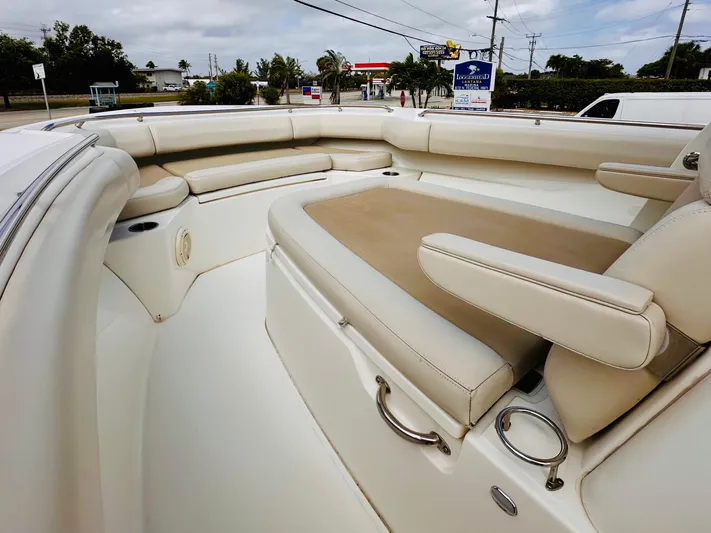 Priced To Sell! Yacht Photos Pics 2020 Boston Whaler 280 Outrage boat interior with beige seating and spacious layout.