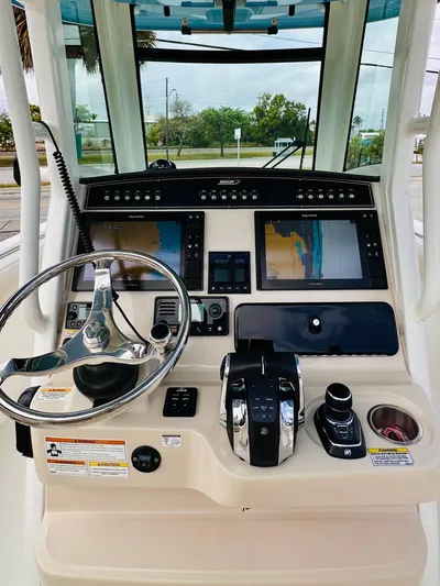 Priced To Sell! Yacht Photos Pics 2020 Boston Whaler 280 Outrage helm with dual displays and steering wheel.