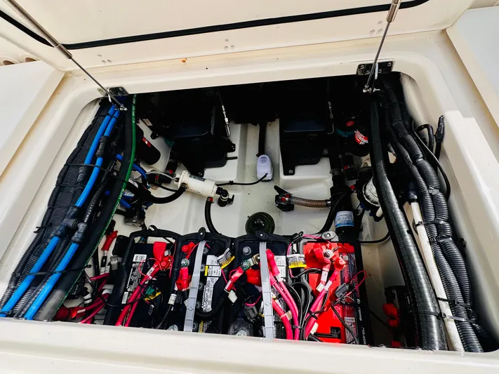 Priced To Sell! Yacht Photos Pics Battery compartment of a 2020 Boston Whaler 280 Outrage boat, showing wiring and components.