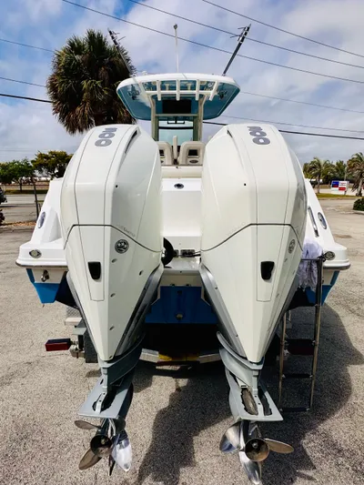 Priced To Sell! Yacht Photos Pics 2020 Boston Whaler 280 Outrage with dual outboard engines, parked on a sunny day.