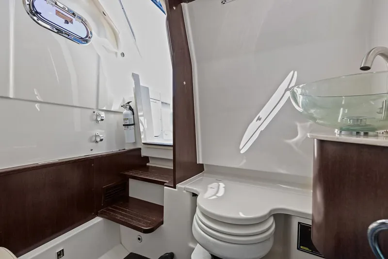  Yacht Photos Pics 2021 Pursuit S 328 Sport boat interior with modern bathroom amenities.