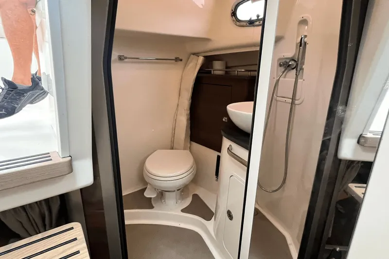 Yacht Photos Pics Interior of 2022 Boston Whaler 345 Conquest bathroom with toilet and sink.