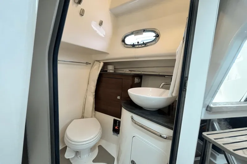 Yacht Photos Pics 2022 Boston Whaler 345 Conquest bathroom with modern sink and toilet.