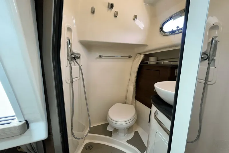  Yacht Photos Pics 2022 Boston Whaler 345 Conquest bathroom with shower, toilet, and sink.