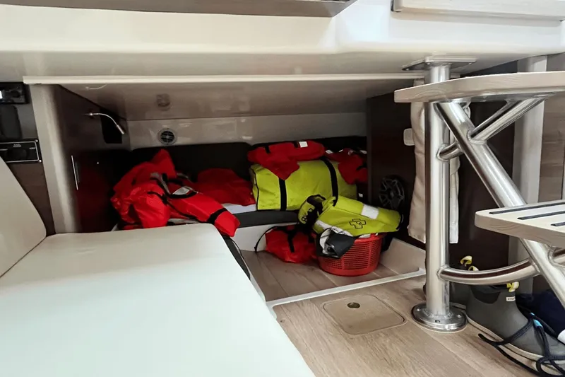  Yacht Photos Pics Storage area on a 2022 Boston Whaler 345 Conquest with life jackets and gear.