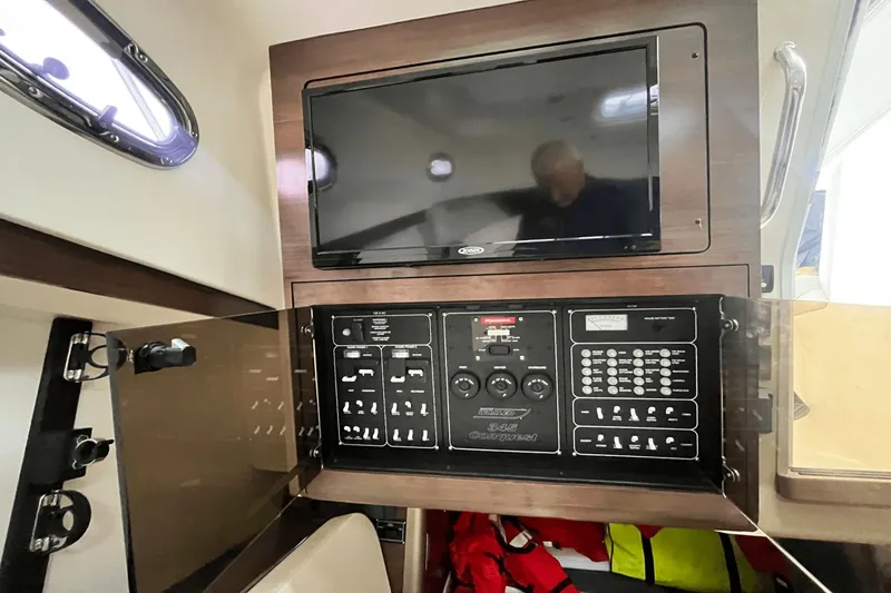  Yacht Photos Pics Interior control panel of 2022 Boston Whaler 345 Conquest boat with display screen.