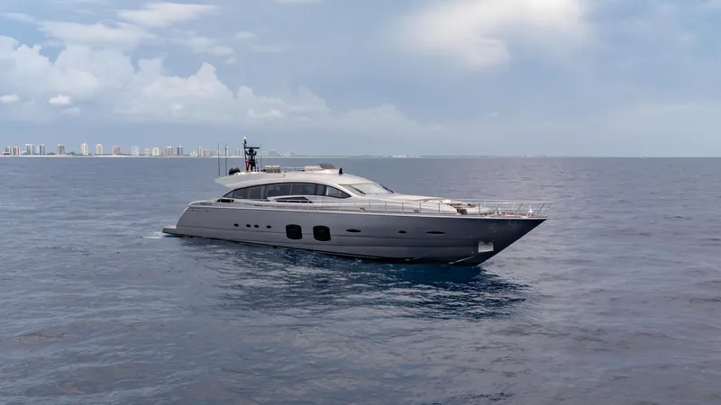  Yacht Photos Pics Luxury Pershing 108 yacht cruising on open sea, 2021 model, with city skyline in background.