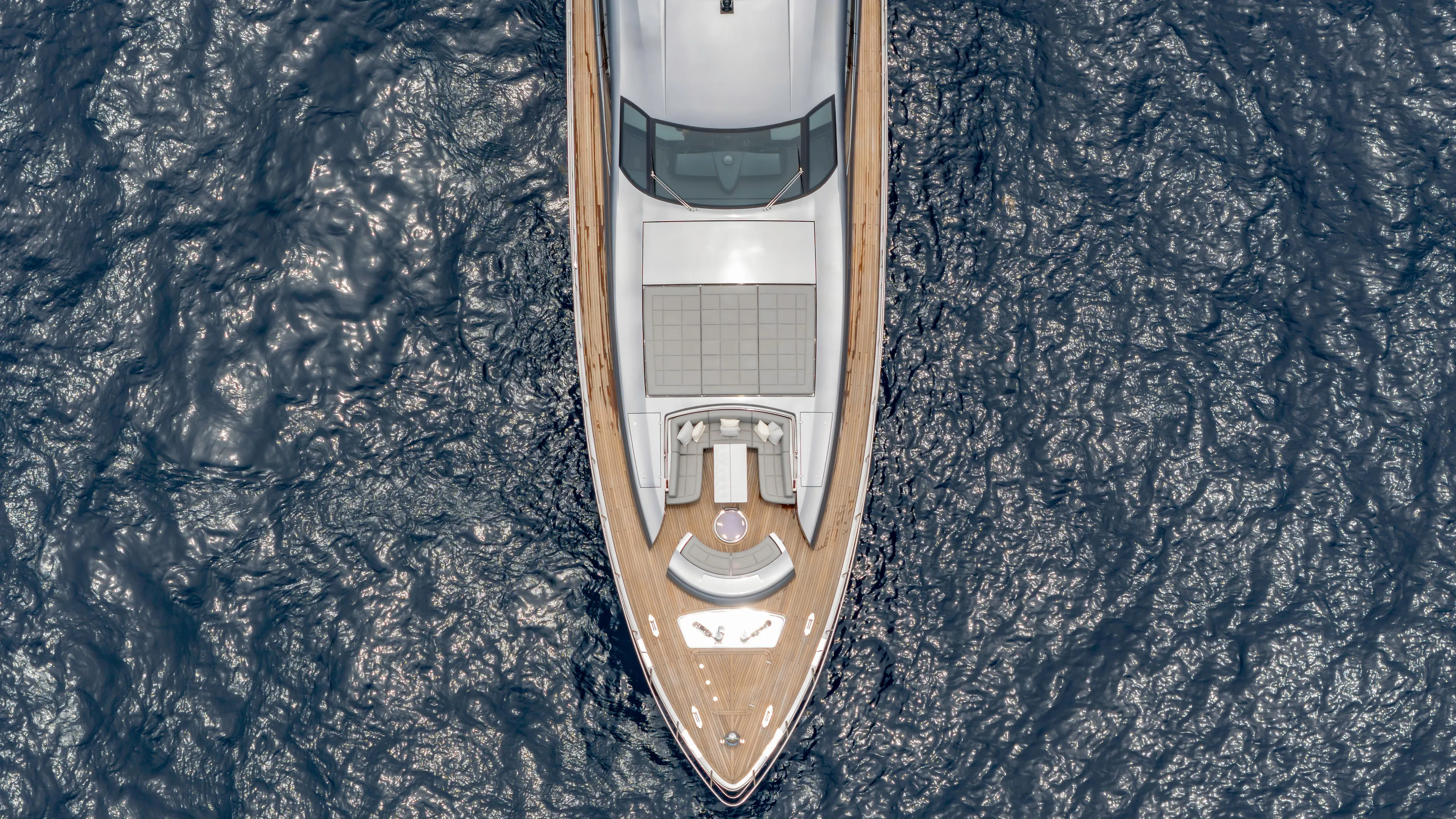  Yacht Photos Pics Aerial view of 2021 Pershing 108 yacht cruising on the ocean.
