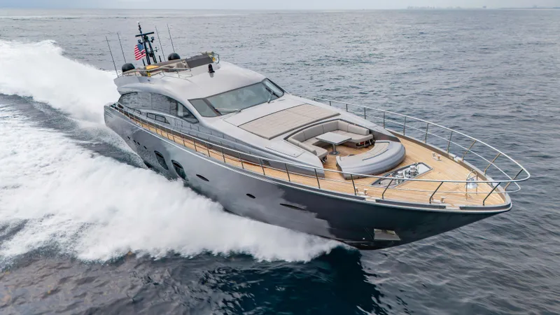  Yacht Photos Pics Luxury 2021 Pershing 108 yacht cruising on open sea, showcasing sleek design and spacious deck.