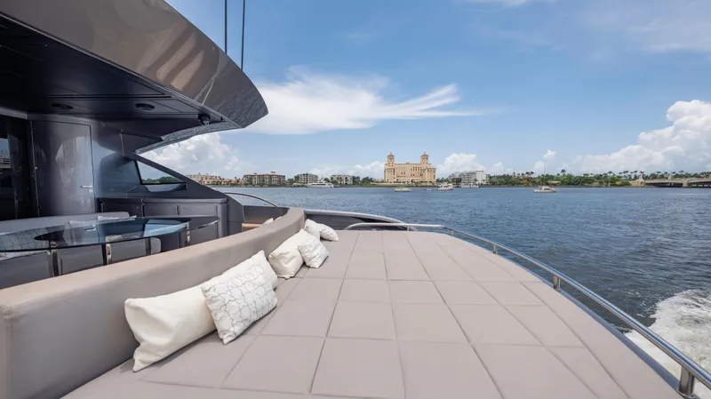  Yacht Photos Pics Luxurious 2021 Pershing 108 yacht with spacious deck, scenic waterfront view.