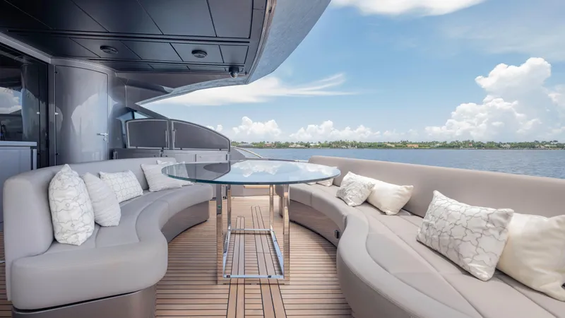  Yacht Photos Pics Luxurious 2021 Pershing 108 yacht deck with elegant seating and ocean view.
