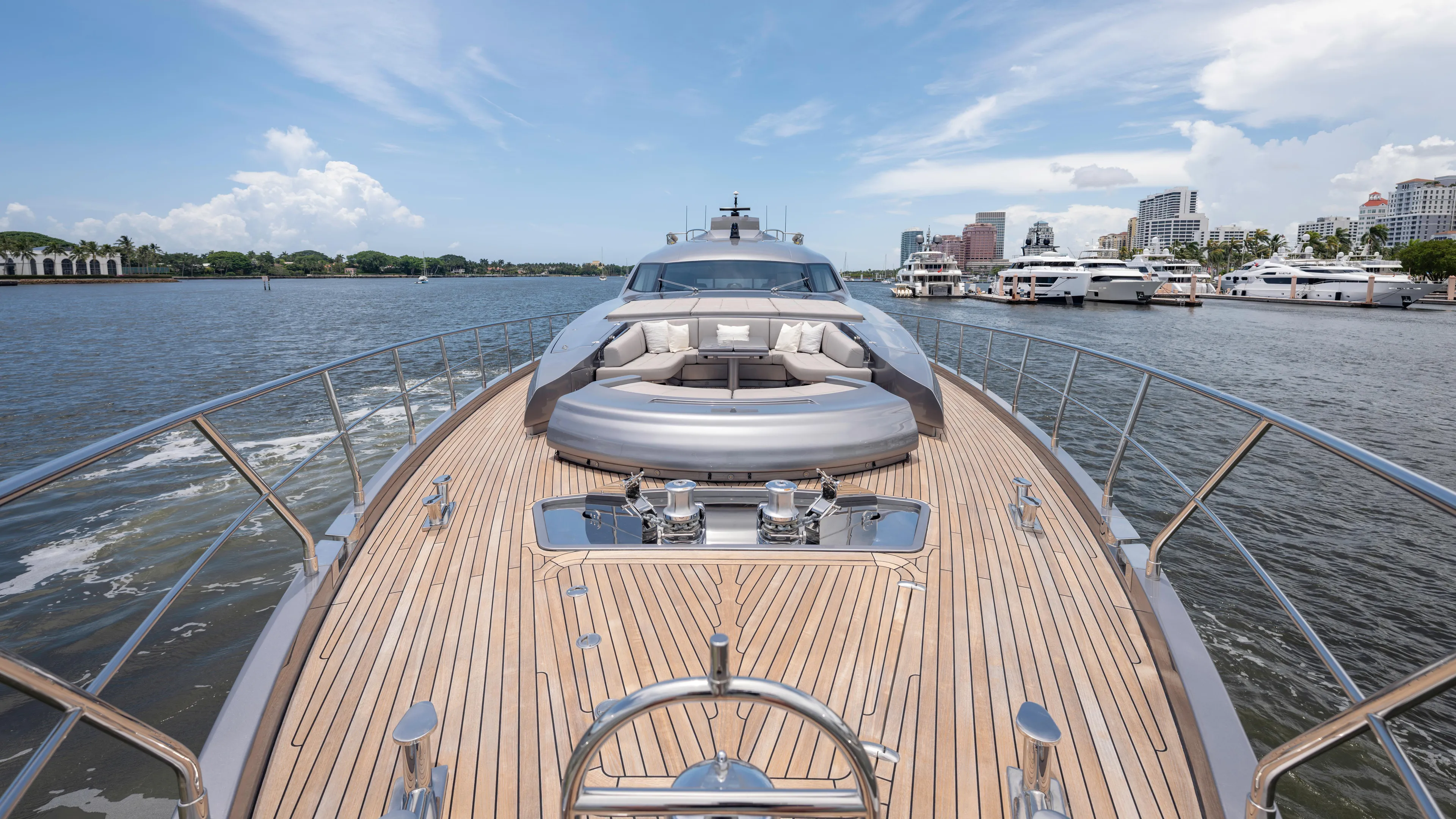  Yacht Photos Pics Luxurious 2021 Pershing 108 yacht with sleek deck design, cruising in a scenic marina.