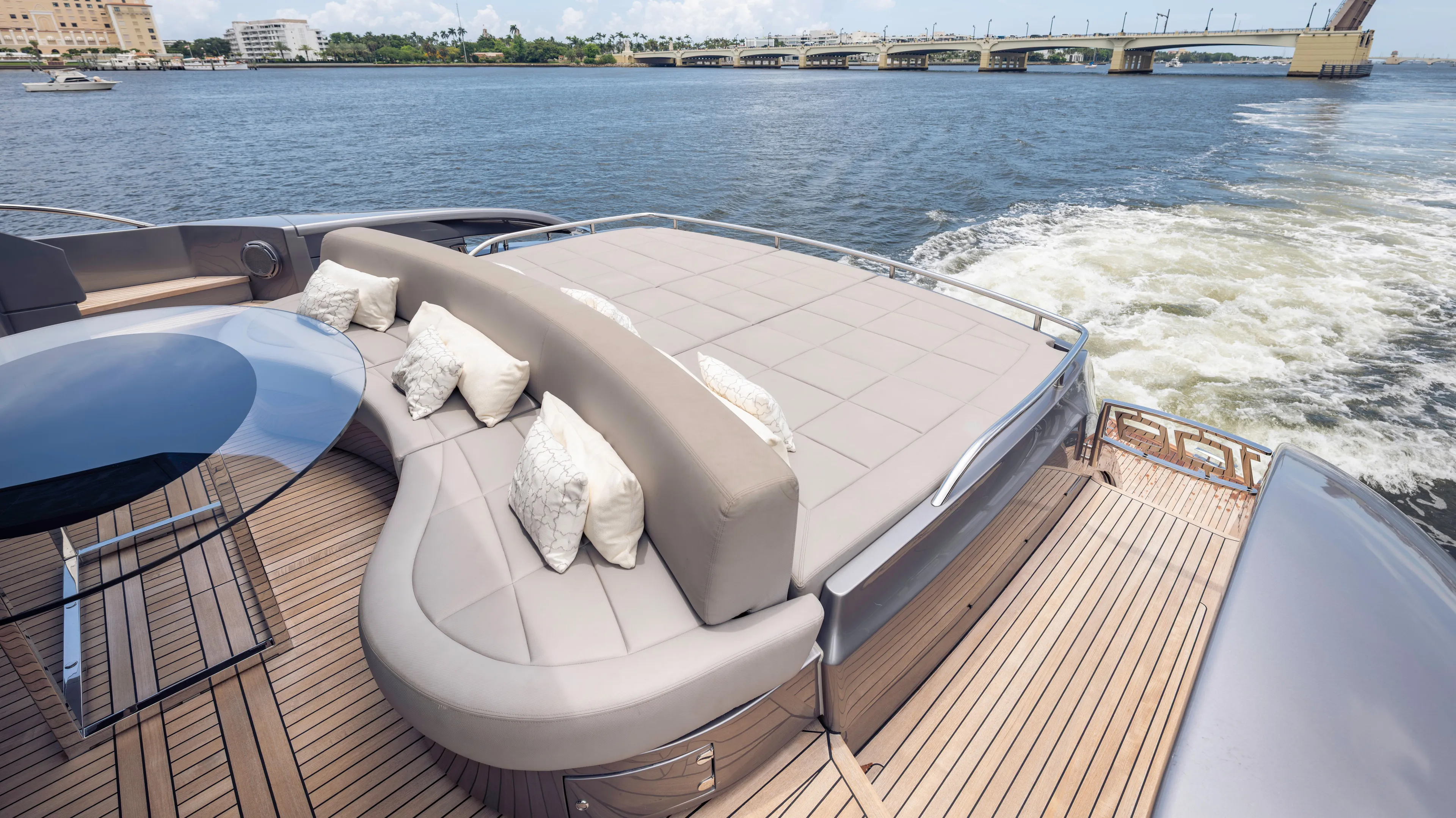  Yacht Photos Pics Luxurious 2021 Pershing 108 yacht deck with elegant seating and scenic water view.