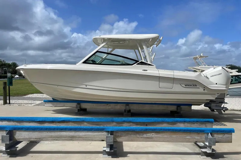 Only 88 Hours! Yacht Photos Pics 2023 Boston Whaler 280 Vantage boat on display under a cloudy sky.