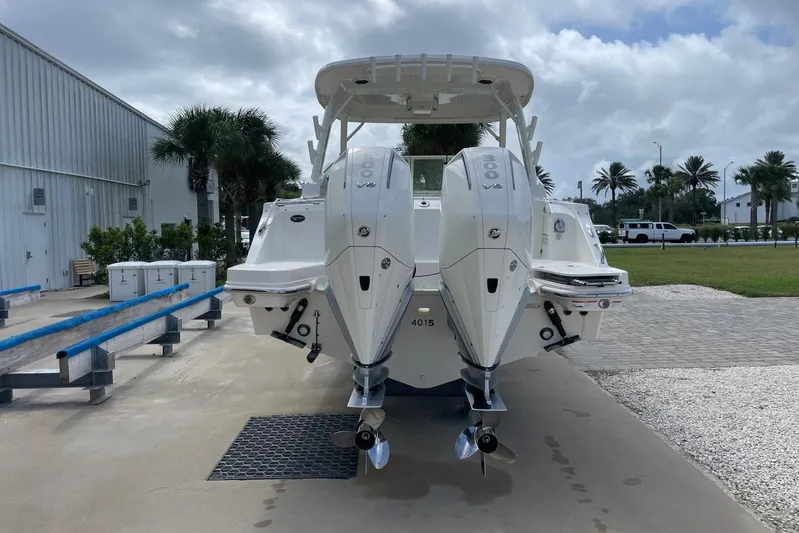 Only 88 Hours! Yacht Photos Pics 2023 Boston Whaler 280 Vantage with dual outboard engines, parked outdoors.