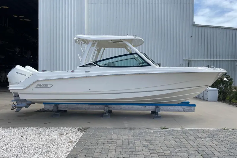 Only 88 Hours! Yacht Photos Pics 2023 Boston Whaler 280 Vantage boat displayed outdoors on a stand.