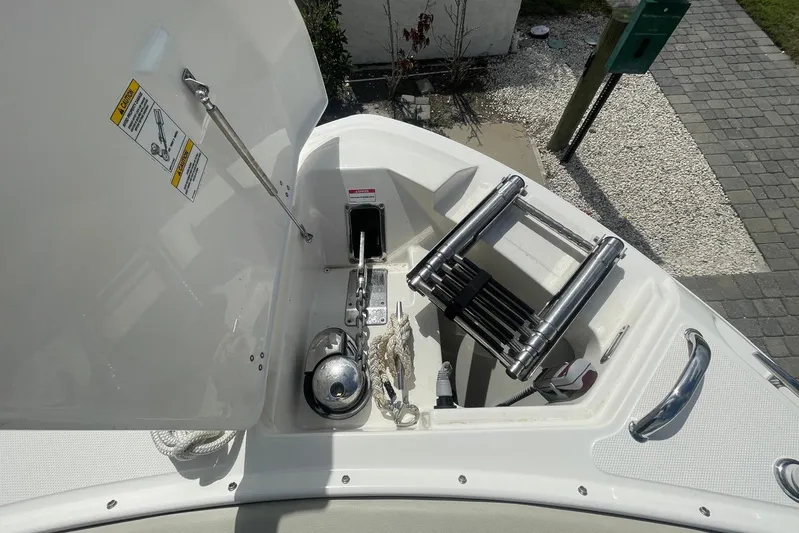 Only 88 Hours! Yacht Photos Pics 2023 Boston Whaler 280 Vantage boat anchor compartment with ladder and equipment.