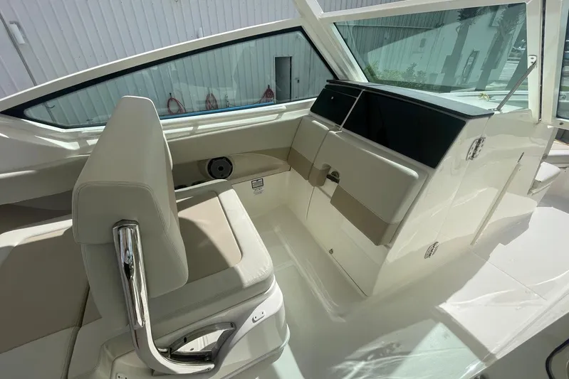 Only 88 Hours! Yacht Photos Pics 2023 Boston Whaler 280 Vantage interior with beige seating and sleek design.