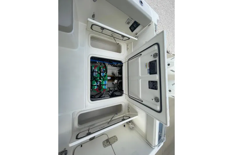 Only 88 Hours! Yacht Photos Pics 2023 Boston Whaler 280 Vantage engine compartment with open hatch, showcasing internal components.
