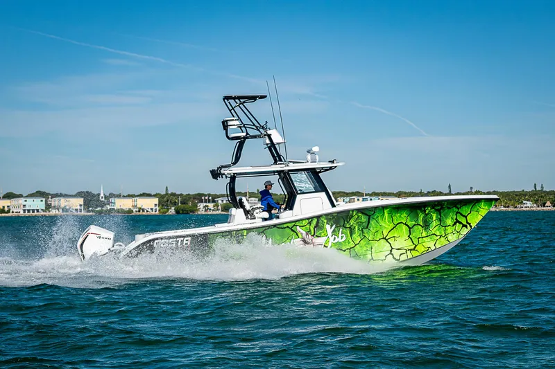  Yacht Photos Pics 2024 Costa Custom Boats 34 cruising on water with vibrant green design.
