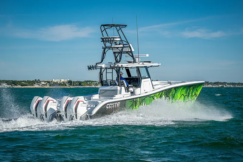 Yacht Photos Pics 2024 Costa Custom Boats 34 cruising on open water with vibrant green hull design.
