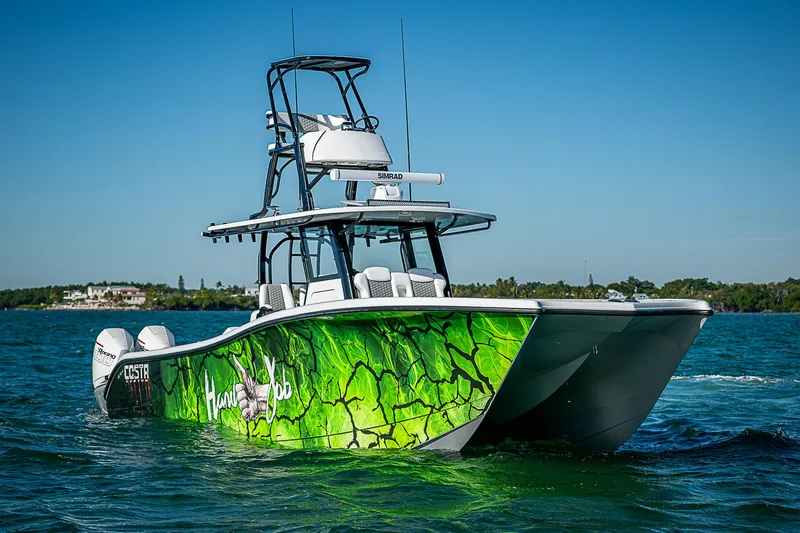  Yacht Photos Pics 2024 Costa Custom Boats 34 with vibrant green design on the water.