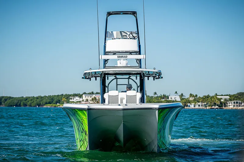  Yacht Photos Pics 2024 Costa Custom Boats 34 on water, vibrant green accents, clear blue sky.