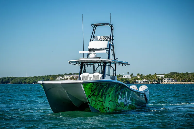  Yacht Photos Pics 2024 Costa Custom Boats 34 on the water, vibrant green hull design.