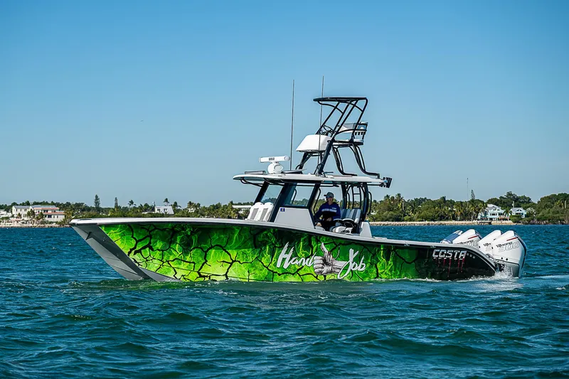  Yacht Photos Pics 2024 Costa Custom Boats 34 with vibrant green hull design on the water.
