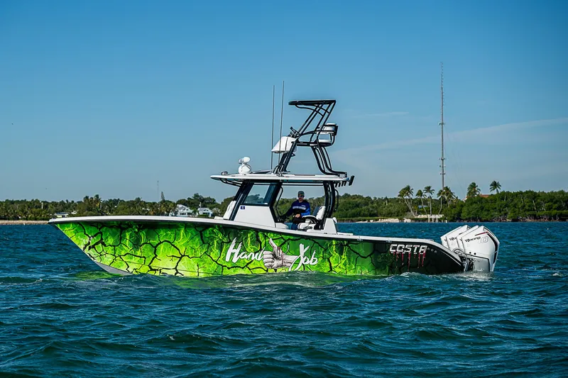  Yacht Photos Pics 2024 Costa Custom Boats 34 with vibrant green hull design on the water.