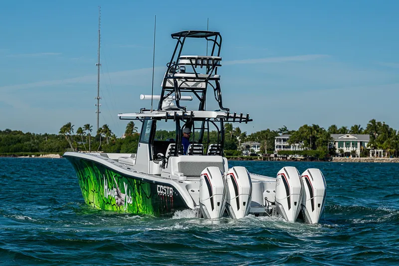  Yacht Photos Pics 2024 Costa Custom Boats 34 with vibrant design and multiple engines on the water.