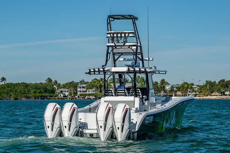  Yacht Photos Pics 2024 Costa Custom Boats 34 with four engines cruising on a sunny day.