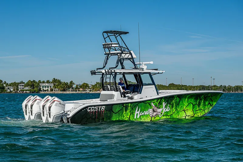  Yacht Photos Pics 2024 Costa Custom Boats 34 with vibrant green hull design on the water.
