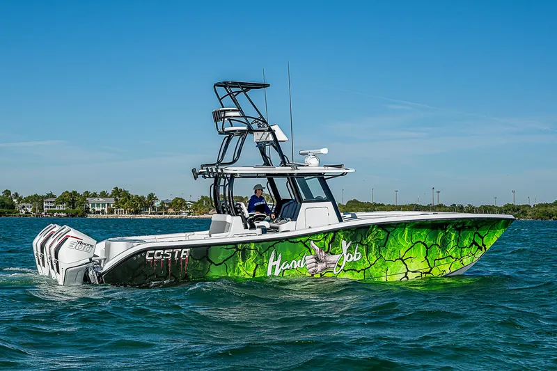  Yacht Photos Pics 2024 Costa Custom Boats 34, vibrant green design, cruising on open water.