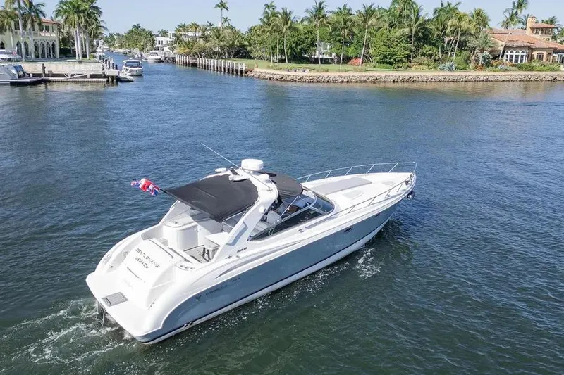 Gentleman's Legacy Yacht Photos Pics 2004 Formula 400 Super Sport Crossover yacht cruising in a scenic waterway.
