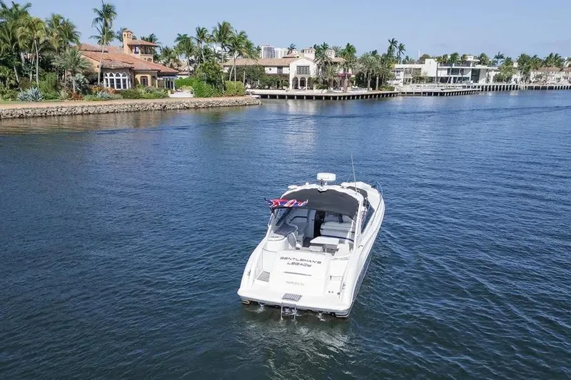Gentleman's Legacy Yacht Photos Pics Aerial view of 2004 Formula 400 Super Sport Crossover boat on a scenic waterway.