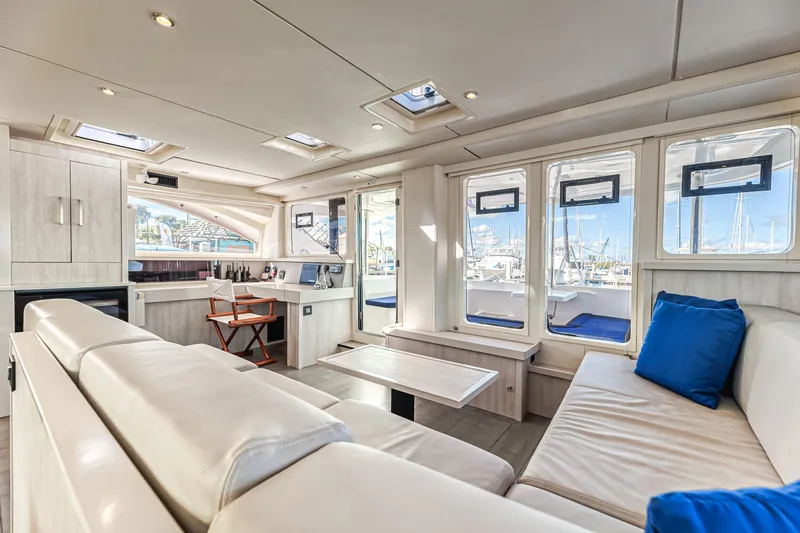 Aquarius Yacht Photos Pics Luxurious interior of 2016 Leopard 58 yacht with modern seating and large windows.